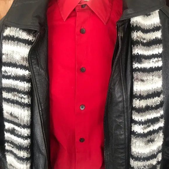 Black leather jacket by a USA designer, and with black sheepskin insulation .