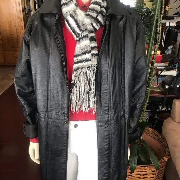 Black leather jacket by a USA designer, and with black sheepskin insulation .
