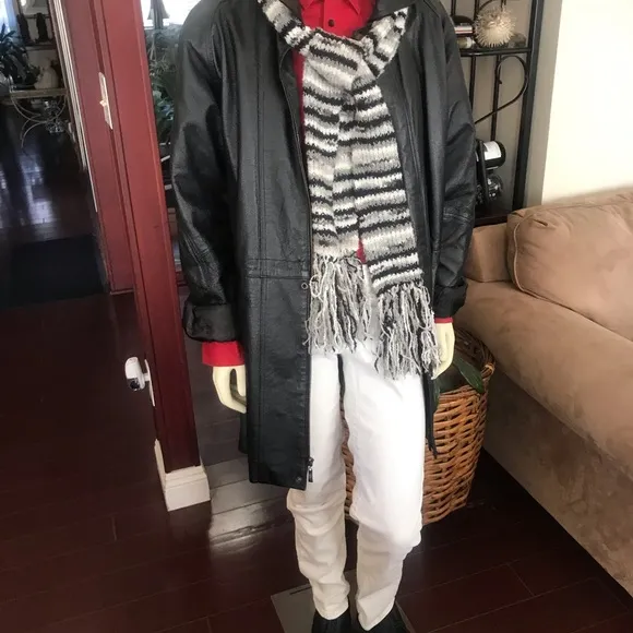 Black leather jacket by a USA designer, and with black sheepskin insulation .