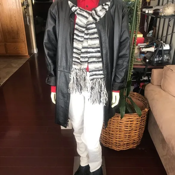 Black leather jacket by a USA designer, and with black sheepskin insulation .