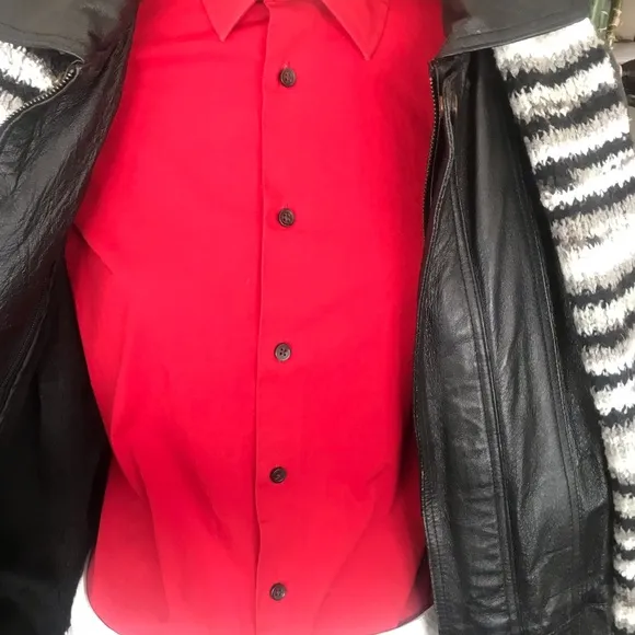 Black leather jacket by a USA designer, and with black sheepskin insulation .