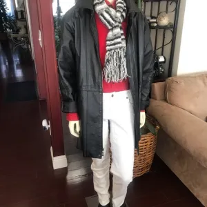 Black leather jacket by a USA designer, and with black sheepskin insulation .