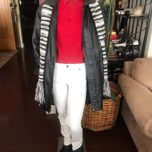 Black leather jacket by a USA designer, and with black sheepskin insulation .