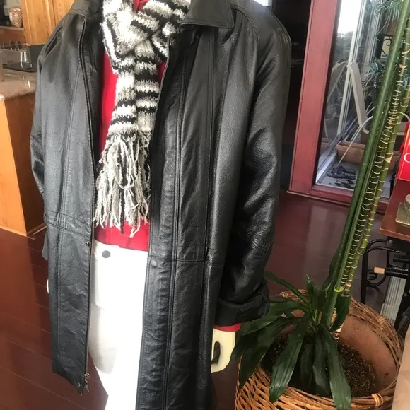 Black leather jacket by a USA designer, and with black sheepskin insulation .