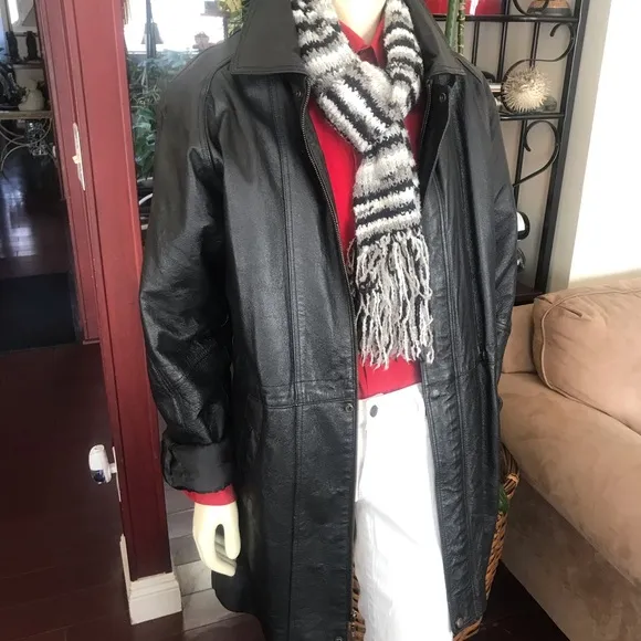 Black leather jacket by a USA designer, and with black sheepskin insulation .