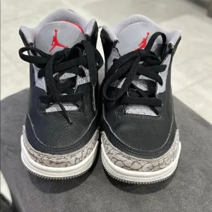 Nike Black and Gray Sneakers with Iconic Design