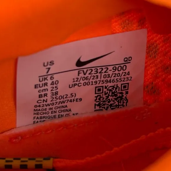 Nike Orange and Black Sneakers with Bold Design