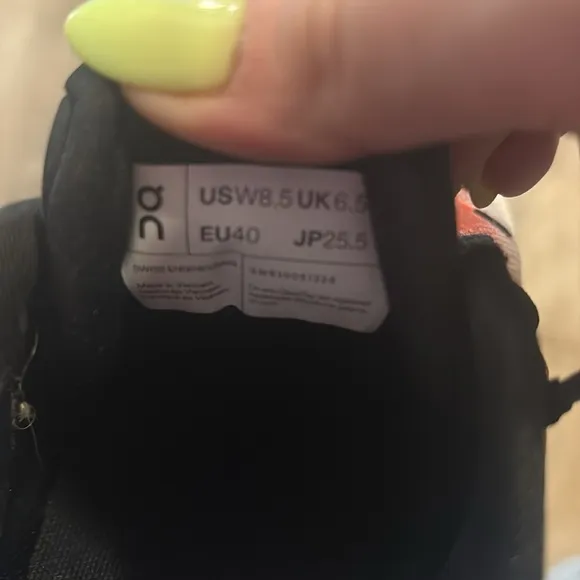 On Running Black and Orange Sneakers with CloudTec Cushioning