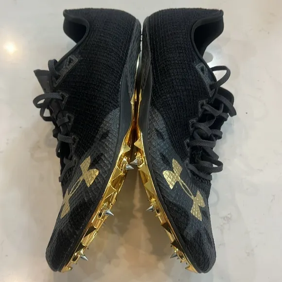 Under Armour HOVR Smoke Rider Track &amp; Field Shoes Size M 9.5/W 11 black Gold