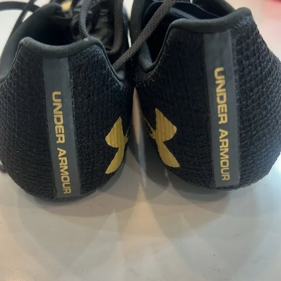 Under Armour HOVR Smoke Rider Track &amp; Field Shoes Size M 9.5/W 11 black Gold